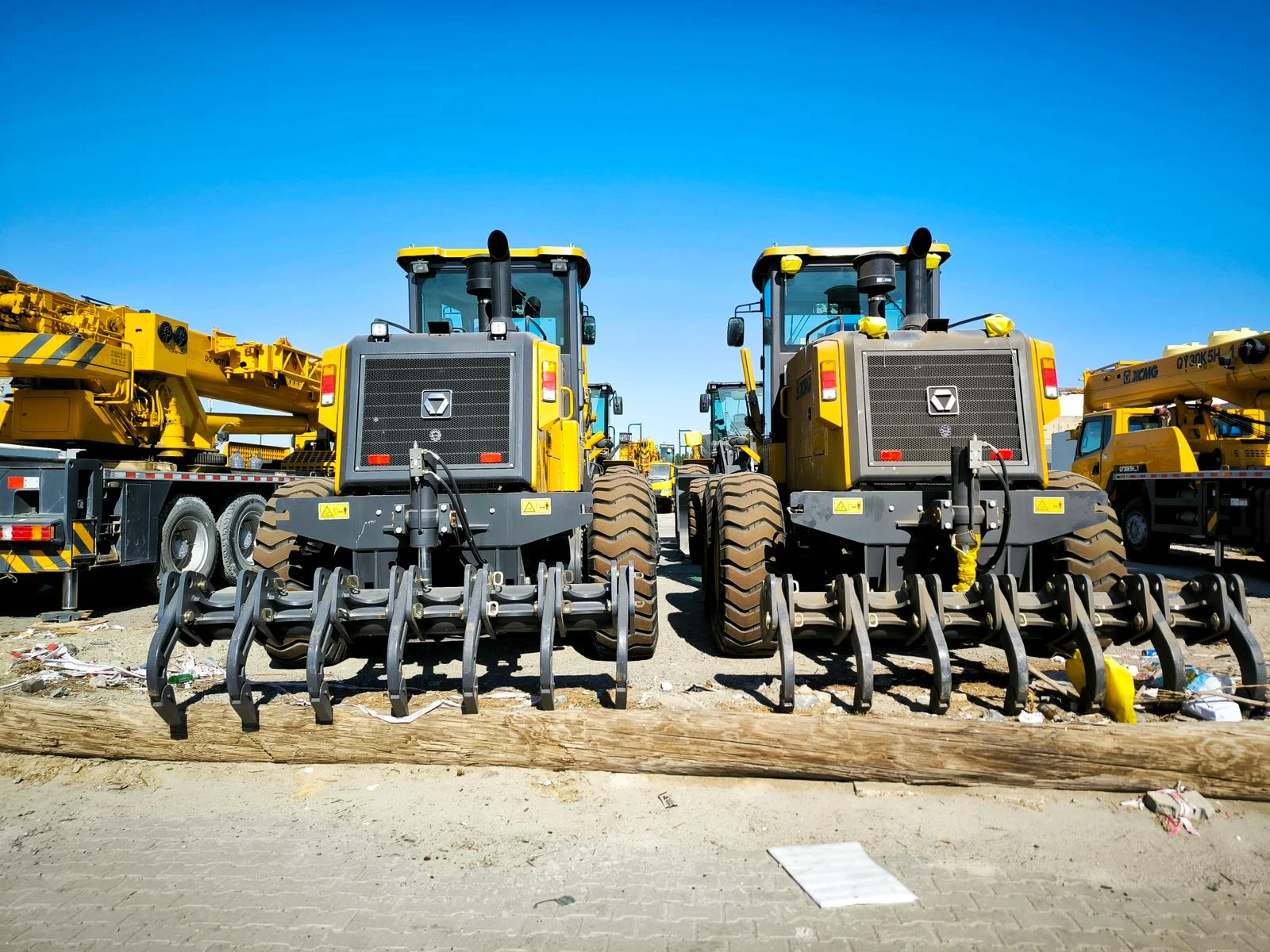Commercial equipment lined up in an equipment yard